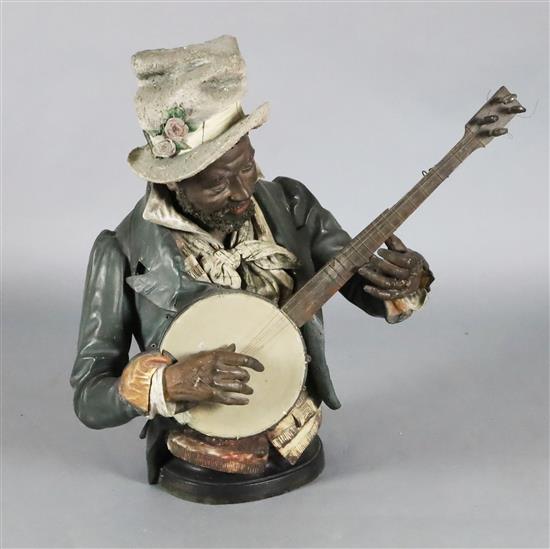 A Goldscheider cold painted terracotta bust of a banjo player, 30in.